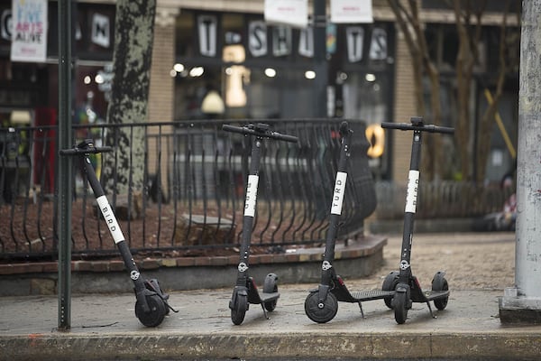 Bird Scooters sit parked on the sidewalk of Euclid Avenue Northeast in Atlanta’s Little Five Points community, Friday, January 4, 2019. (ALYSSA POINTER/ALYSSA.POINTER@AJC.COM)