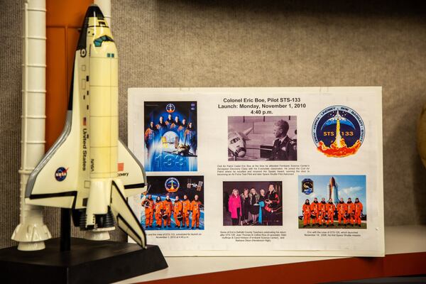 A plaque containing pictures of Astronaut Eric Boe is on display at the Fernbank Science Center in Decatur. (Photo by Phil Skinner)