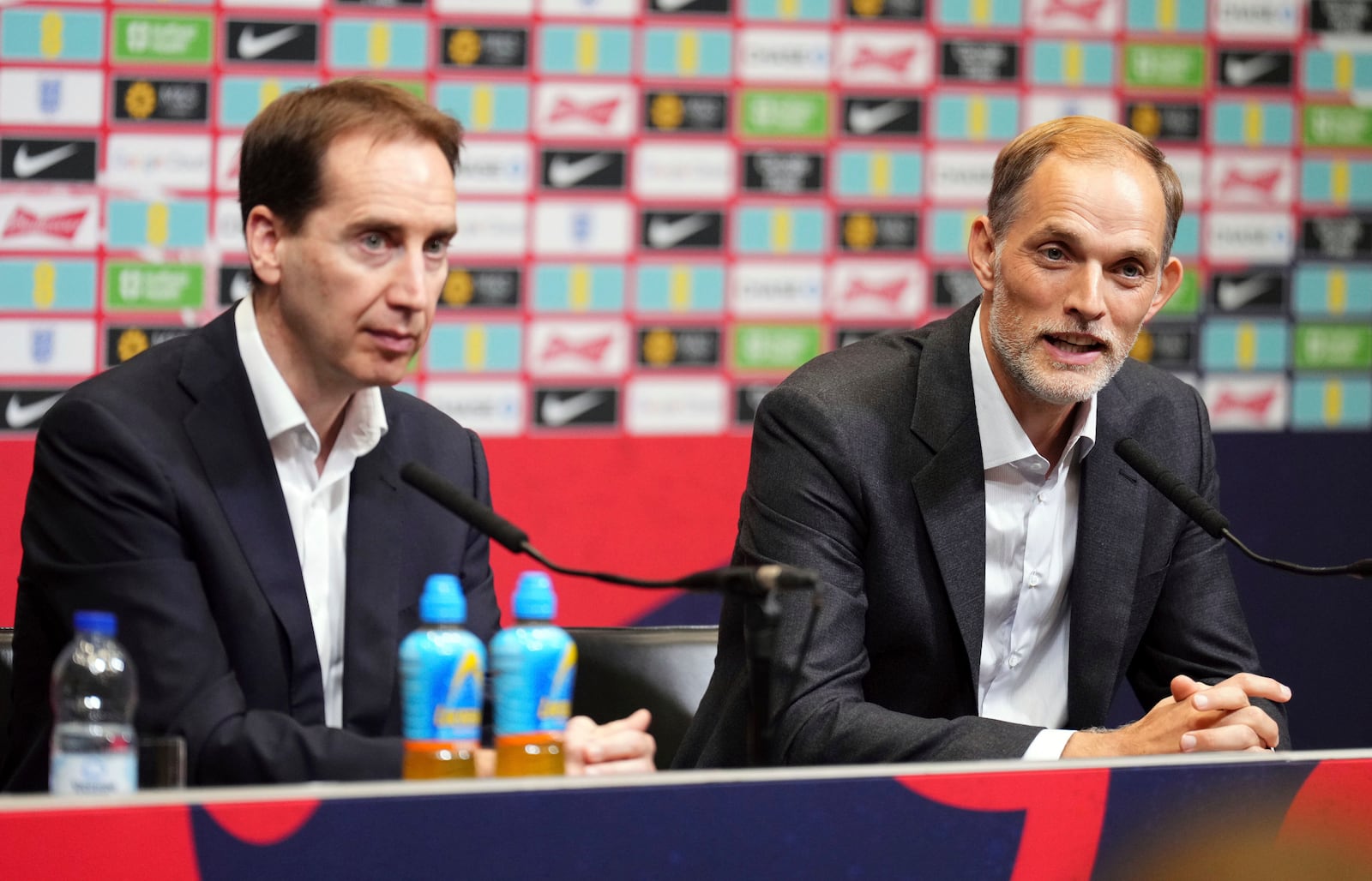 Newly appointed England national soccer team head coach Thomas Tuchel and FA CEO Mark Bullingham, left, attend a press conference at Wembley Stadium, London Wednesday Oct. 16, 2024. (John Walton/PA via AP)