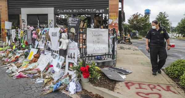 Atlanta police and sanitation crews finish removing protesters and their belongings Monday from outside the Wendy’s where Rayshard Brooks was killed by an officer last month and near where 8-year-old Secoriea Turner was fatally shot while sitting in a car over the July Fourth weekend. JOHN SPINK / JSPINK@AJC.COM