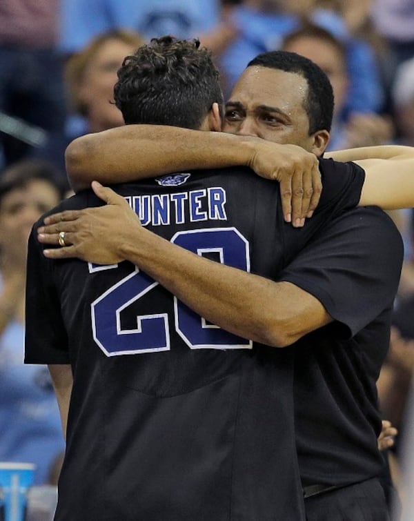 Georgia State head coach Ron Hunter hugs his son R.J. after taking him out of the game against Xavier during the second half of an NCAA tournament third round basketball game Saturday, March 21, 2015, in Jacksonville, Fla. Xavier defeated Georgia State 75-67. (AP Photo/Chris O'Meara) The Hunters, father and son. (AP photo/Chris O'Meara)