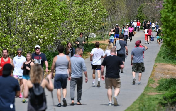 People walk, bike and exercise on Atlanta Beltline’s Eastside Trail side on Saturday, March 21, 2020. The trail remained busy while bars and restaurants along the trail were mostly quiet. Mayor Keisha Lance Bottoms said the Beltline will remain open for now. HYOSUB SHIN / HYOSUB.SHIN@AJC.COM