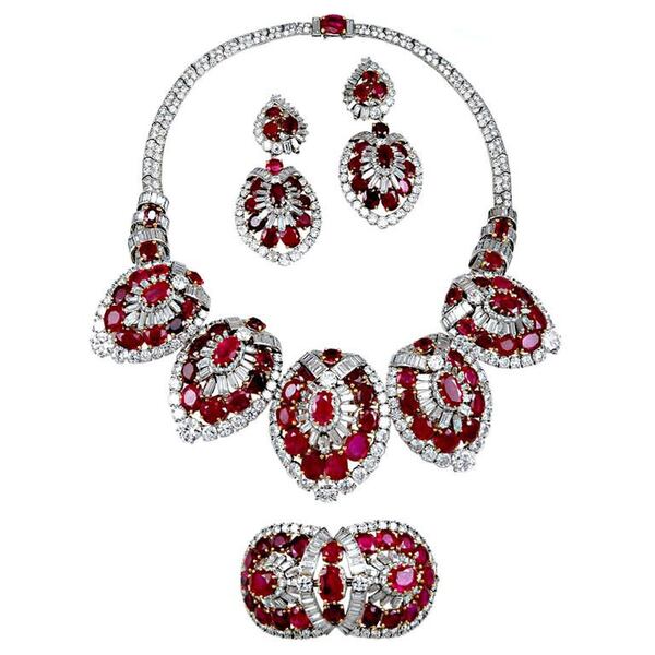 This early 20th-late 19th century ruby and diamond parure by Cartier will display nicely against the cut of the Lhuillier gown. But remember to wear the bracelet (bottom) outside, not inside, the opera-length white gloves.