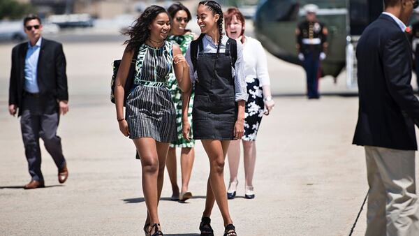 Sasha Obama (L), US first lady Michelle Obama (C) and Malia Obama (R) follow US President Barack Obama to Air Force One at Andrews Air Force Base to travel to National Parks in New Mexico and California on June 15, 2016 in Maryland. (BRENDAN SMIALOWSKI/AFP/Getty Images)