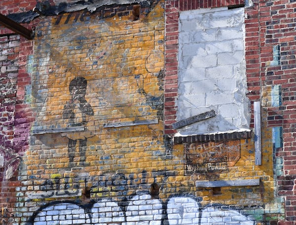 “Gold Dust Baby” mural seen on a historic building on the corner of Jesse Hill Jr. Drive and Auburn Avenue Monday, Nov. 8, 2021. (Daniel Varnado/ For the Atlanta Journal-Constitution)