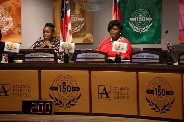 Atlanta Public Schools Board Chair Eshé Collins (left) and Superintendent Lisa Herring listen at the start of the public comments portion of the Atlanta Public Schools board meeting, Monday, Aug. 8, 2022, in Atlanta. (Jason Getz / Jason.Getz@ajc.com)