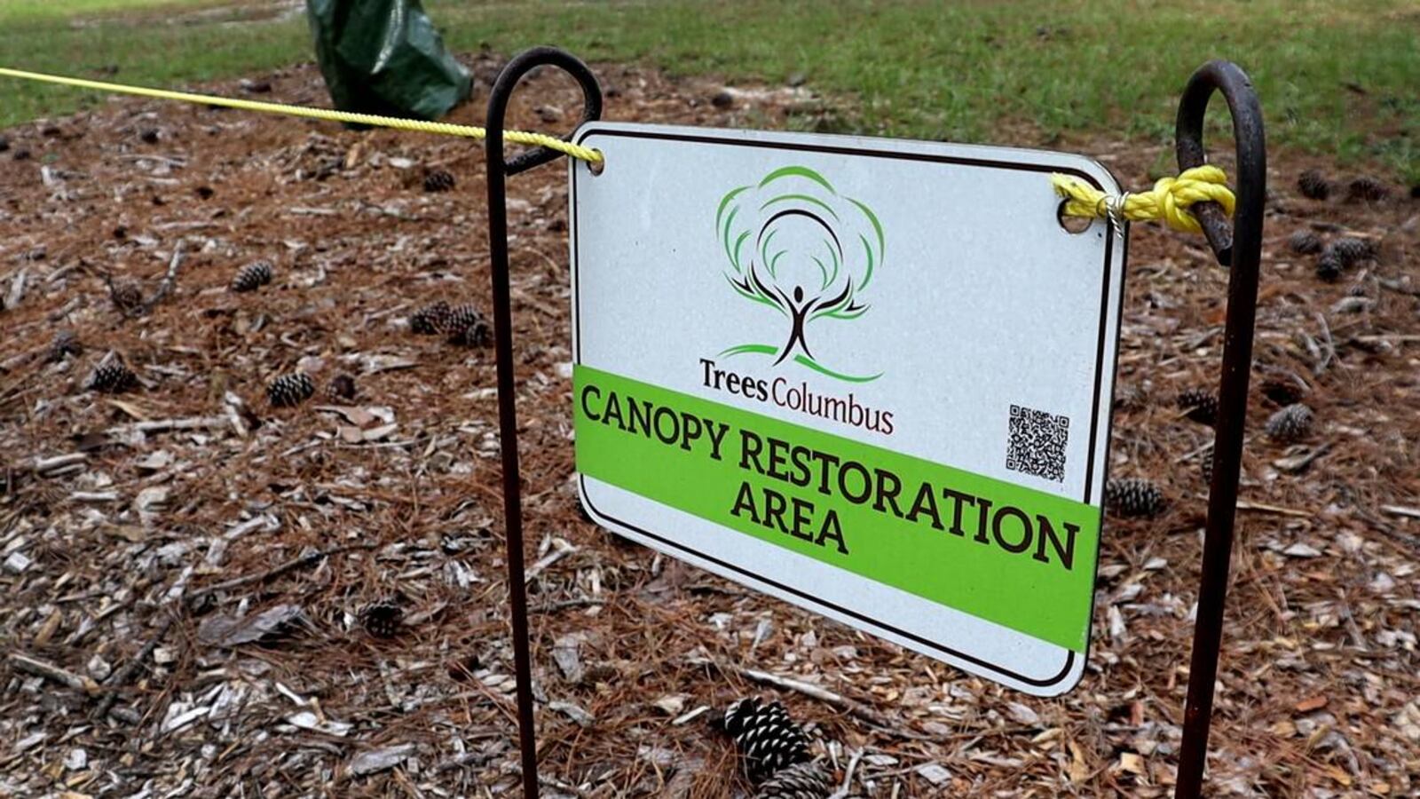 Trees Columbus lined the pathway at Carver Park with signs to keep disturbances away while the area undergoes restoration. (Photo Courtesy of Kala Hunter)