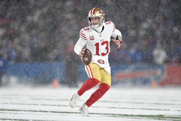 San Francisco 49ers quarterback Brock Purdy (13) looks to pass against the Buffalo Bills during the first half of an NFL football game in Orchard Park, N.Y., Sunday, Dec. 1, 2024. (AP Photo/Adrian Kraus)