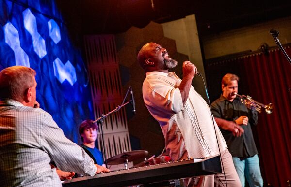 Eric Moore, center, jams on vocals at Joe Gransden's Jazz Jam held every Wednesday at Venkman's. (Jenni Girtman for The Atlanta Journal-Constitution)