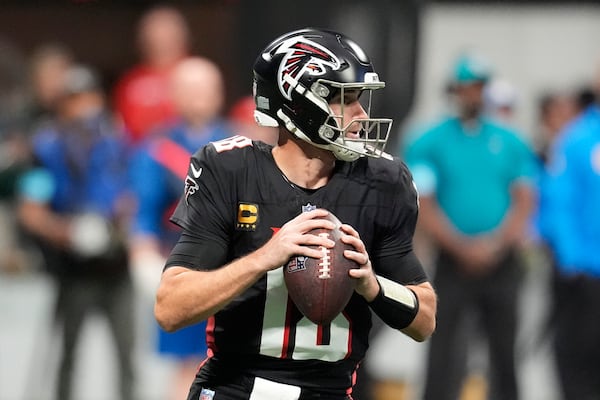 Atlanta Falcons quarterback Kirk Cousins (18) looks to pass during the first half of an NFL football game against the Los Angeles Chargers on Sunday, Dec. 1, 2024 in Atlanta.(AP Photo/Mike Stewart)