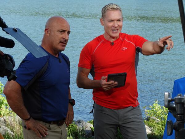 Sam Champion (right) with Jim Cantore when he worked at AMHQ last June. CREDIT: Rodney Ho/rho@ajc.com