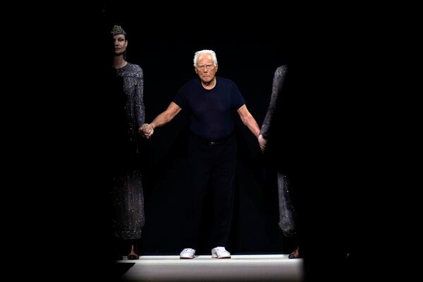 Giorgio Armani acknowledges the applause at the end of the Giorgio Armani Fall/Winter 2025-2026 Women's collection presented in Milan, Italy, Sunday, March 2, 2025. (AP Photo/Luca Bruno)