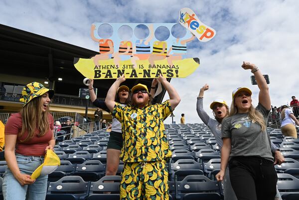 Savannah Bananas fans cheer before their first of three-game series at Coolray Field, Saturday, March 23, 2024, in Lawrenceville. The Savannah Bananas’ visit is their first to the Atlanta area since their founding in 2016. The team is based in their namesake Georgia city and plays 30-plus games a year at Historic Grayson Stadium, a century-old ballpark on Savannah’s eastside. (Hyosub Shin / Hyosub.Shin@ajc.com)