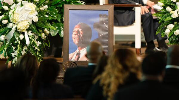 A photograph of Henry "Hank" Aaron, longtime Atlanta Braves player and Hall of Famer, sits near his casket during funeral services Wednesday, Jan. 27, 2021, at Friendship Baptist Church in Atlanta. (Kevin D. Liles/Atlanta Braves)