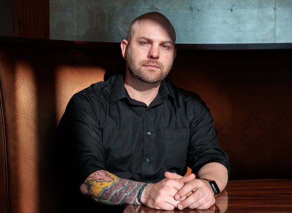 Afghanistan veteran Zack Knight poses for a portrait at the Buckhead Club in Atlanta on Friday, November 4, 2022. Knight owns his own leadership company and serves as the marketing and communications chair for VETLANTA.   (Arvin Temkar / arvin.temkar@ajc.com)