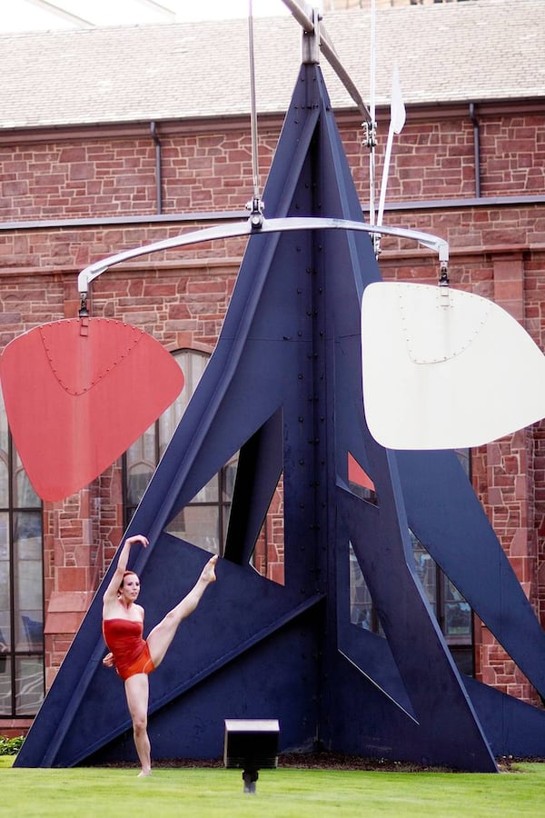 Dance artist Sarah Hillmer interprets Alexander Calder’s kinetic sculpture, “Three Up, Three Down” in 2010 on the High Museum lawn. Contributed by Greg Mooney