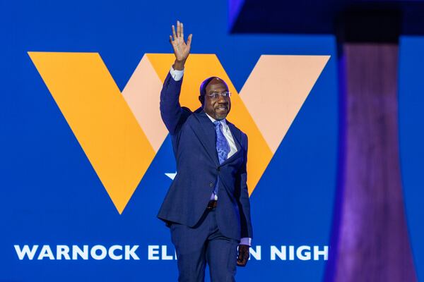 U.S. Sen. Raphael Warnock walks on stage to address supporters at his election night watch party at the Atlanta Marriott Marquis in Atlanta on Tuesday, November 8, 2022. (Arvin Temkar / arvin.temkar@ajc.com)