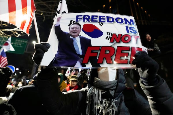 A supporters of impeached South Korean President Yoon Suk Yeol attends a rally to oppose his impeachment near the presidential residence in Seoul, South Korea, Saturday, March 8, 2025. (AP Photo/Ahn Young-joon)