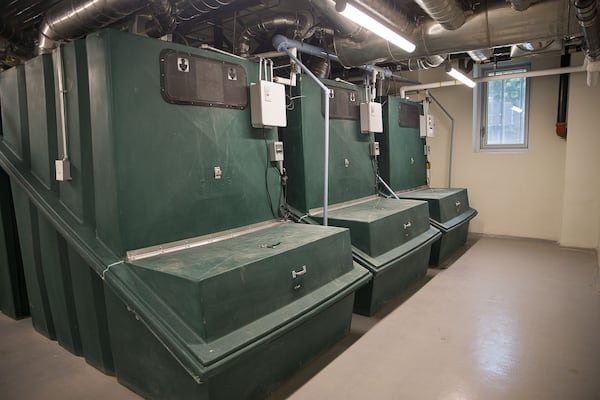 The natural plumbing system at the Kendeda Building for Innovative Sustainable Design features huge containers that collect solid and human waste separately. Solid human waste from the composting toilets is decomposed by containers (shown here) holding wood shavings. These shavings will eventually be taken from the building and will be used as fertilizer for farmers or whoever is interested in the natural fertilizer. ALYSSA POINTER / ALYSSA.POINTER@AJC.COM