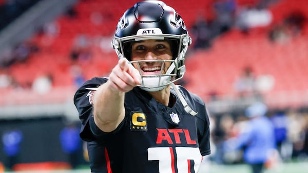 Falcons quarterback Kirk Cousins (18) signals to the fans during warm-ups before the Falcons face the Los Angeles Chargers on Sunday, December 1, 2024, at Mercedes-Benz Stadium in Atlanta. 
(Miguel Martinez/ AJC)