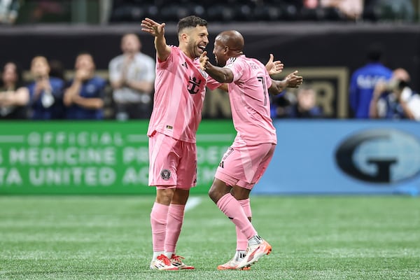 Inter Miami defender Jordi Alba, left, celebrates with Inter Miami midfielder Fafà Picault (7) during the second half of an MLS soccer match against Atlanta United, Sunday, March 16, 2025, in Atlanta. (AP Photo/Colin Hubbard)