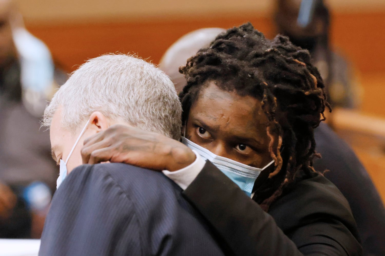 Young Thug, whose real name is Jeffery Williams, speaks to his lawyer Brian Steel during the Jury selection portion of the trial at Fulton County courtroom on Monday, Feb 6, 2023. Miguel Martinez / miguel.martinezjimenez@ajc.com