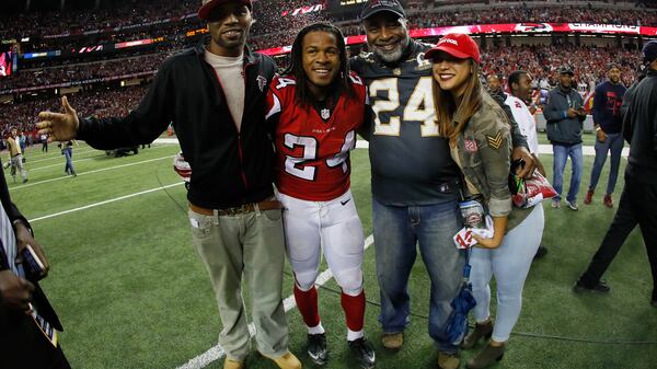  Falcons running back Devonta Freeman celebrates with his family after defeating the Green Bay Packers in the NFC Championship Game at the Georgia Dome on January 22, 2017 in Atlanta, Georgia. The Falcons defeated the Packers 44-21. (Kevin C. Cox/Getty Images)