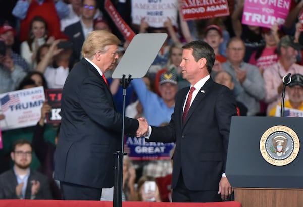 GOP gubernatorial candidate Brian Kemp and President Donald J. Trump shake hands during President Donald J. Trump's Make America Great Again Rally to support Brian Kemp at Middle Georgia Regional Airport in MaconSunday, November 4, 2018. (Hyosub Shin / hyosub.shin@ajc.com