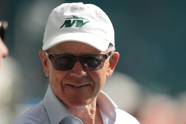 New York Jets owner Woody Johnson walks the field before an NFL football game against the Miami Dolphins, Sunday, Dec. 8, 2024, in Miami Gardens, Fla. (AP Photo/Lynne Sladky)