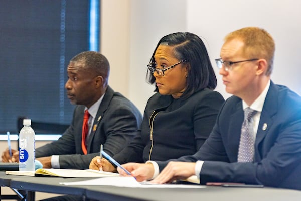 Fulton County District Attorney Fani Willis (center) listens during the jury selection process at the Jury Assembly Room at Fulton County Courthouse in Atlanta on Tuesday, July 11, 2023. Two Fulton County grand juries are being selected, one of which will be expected to decide whether to hand up an indictment in the long-running investigation into alleged meddling with the 2020 presidential election. (Arvin Temkar / arvin.temkar@ajc.com)