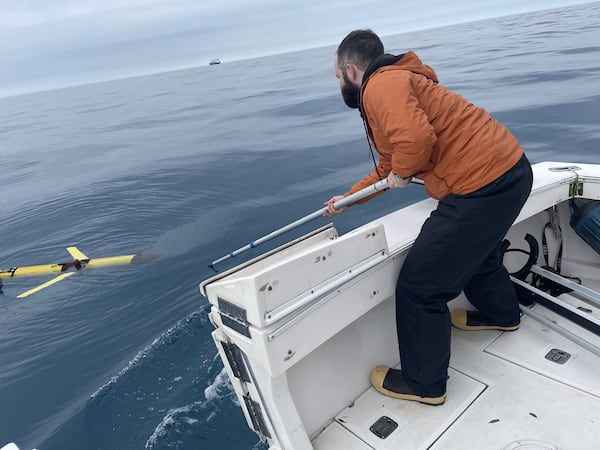 UGA Skidaway Institute doctoral student and Edwards Lab member Frank McQuarrie recovers a Teledyne G3 Slocum Glider in January 2024. (Photo Courtesy of the Catherine Edwards Lab)