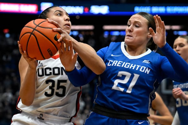 UConn guard Azzi Fudd (35) is guarded by Creighton guard Molly Mogensen (21) in the first half of an NCAA college basketball game, Thursday, Feb. 27, 2025, in Hartford, Conn. (AP Photo/Jessica Hill)