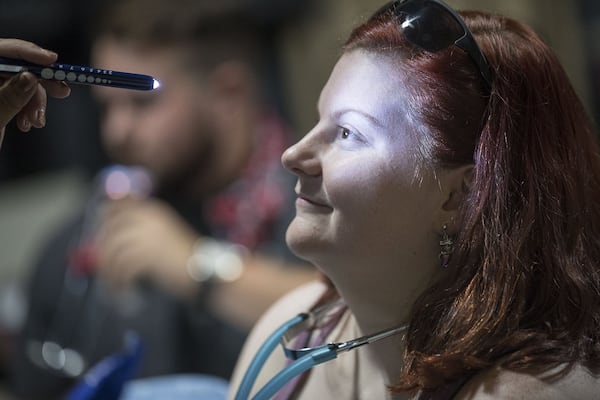 Savannah Bray of Conyers gets her vitals checked before the start of the September EMT class at the Georgia Institute of EMS in Covington in August. The classes run for 18 weeks and provide students with initial EMT and advanced EMT training. (Alyssa Pointer/alyssa.pointer@ajc.com)