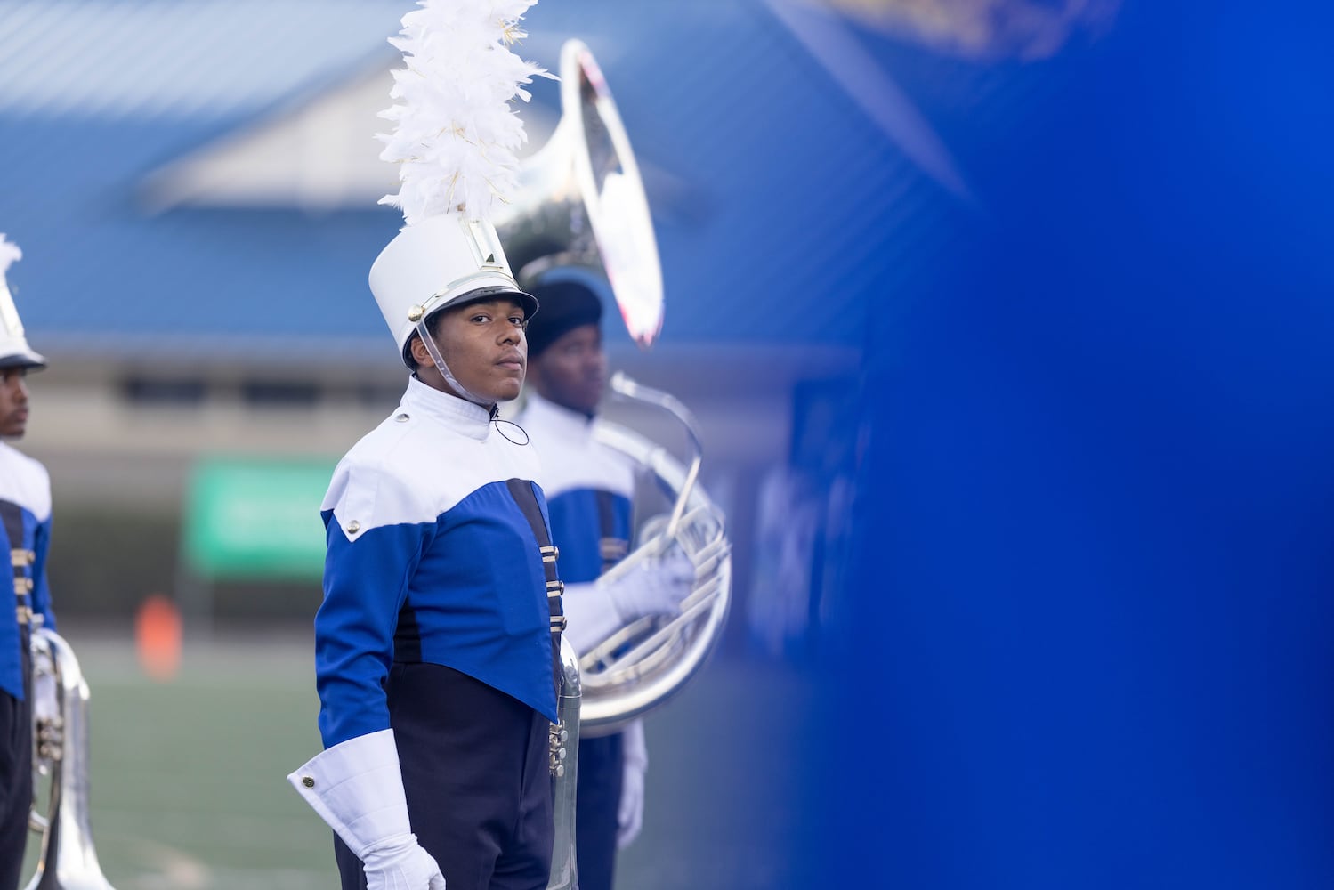 A McEachern band member stands before a GHSA High School football game between Langston Hughes High School and McEachern High School at McEachern High School in Powder Springs, GA., on Friday, August 26, 2022. (Photo by Jenn Finch)