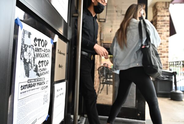 A poster for the Stop Anti-Asian rally is taped up outside Sweet Hut Bakery Cafe in Asian Square Plaza in Doraville. Nationwide, the group Stop AAPI Hate recorded almost 3,800 hate incidents against Asian Americans between March 2020 and February of this year. (Hyosub Shin / Hyosub.Shin@ajc.com)