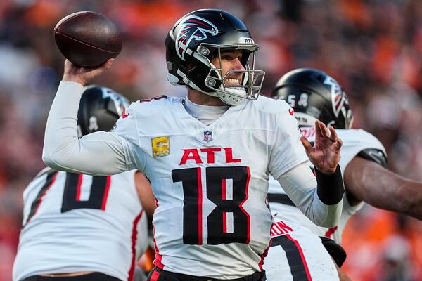 Atlanta Falcons quarterback Kirk Cousins (18) passes against the Denver Broncos during the second half of an NFL football game, Sunday, Nov. 17, 2024, in Denver. (AP Photo/David Zalubowski)