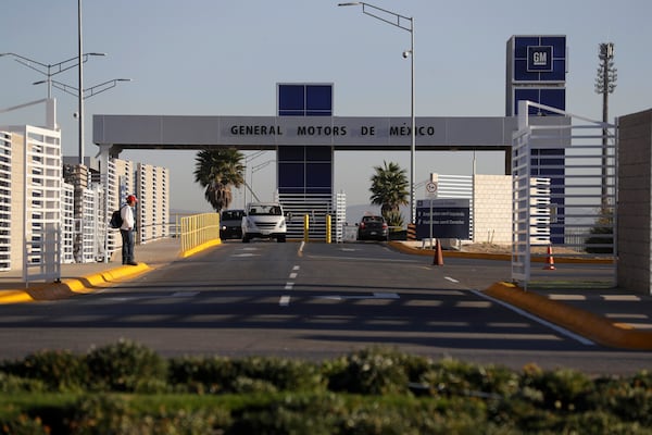 FILE - Cars exit the General Motors assembly plant in Villa de Reyes, outside San Luis Potosi, Mexico, Jan. 4, 2017. (AP Photo/Rebecca Blackwell, File)