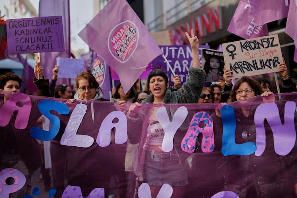 Women chant slogans during a protest marking International Women's Day in Istanbul, Turkey, Saturday, March 8, 2025. (AP Photo/Emrah Gurel)