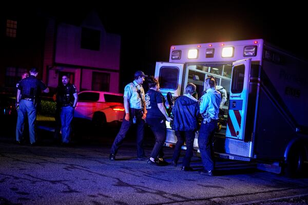 A man is loaded into an ambulance after a shooting early Tuesday morning in Cobb County.