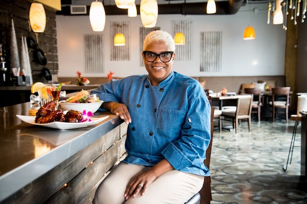  Chef/owner Deborah VanTrece at the bar at Twisted Soul Cookhouse & Pours. Photo credit- Mia Yakel.