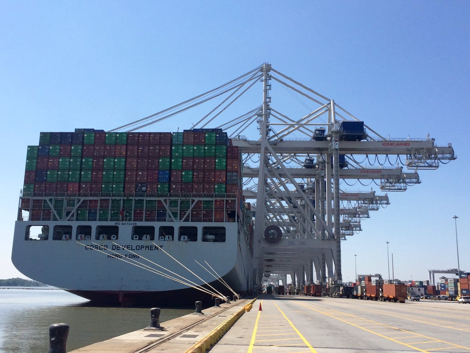 Six cranes load and unload containers in May 2017 at the Port of Savannah from the Cosco Development.