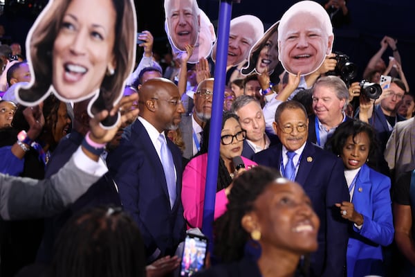 Georgia delegates, including Sen. Raphael Warnock, second from left, U.S. Rep. Nikema Williams, and U.S. Rep Sanford D. Bishop, officially nominate Kamala Harris as the Democratic presidential candidate during the roll call of the states on Tuesday, Aug. 20, 2024, at the Democratic National Convention in Chicago. (Arvin Temkar/AJC)