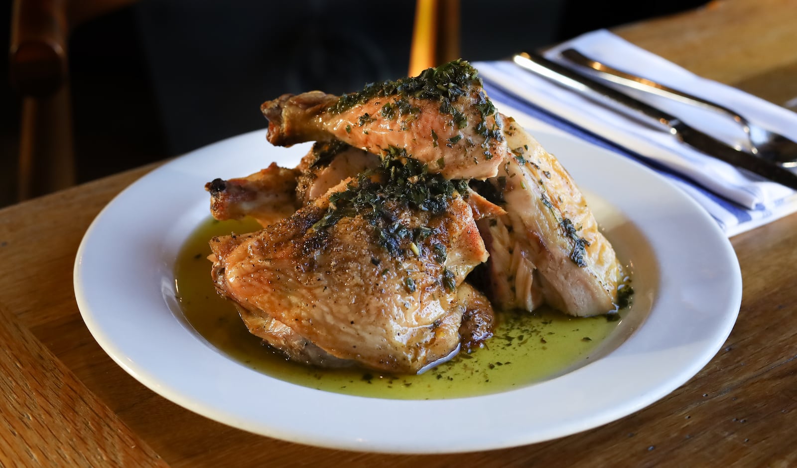 Roasted chicken with jalapeno salsa verde from the menu of Adele's.