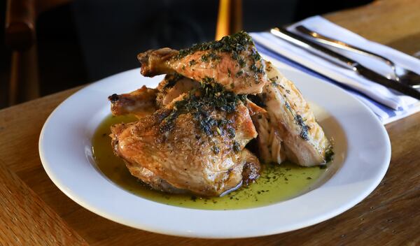 Roasted chicken with jalapeno salsa verde from the menu of Adele's.