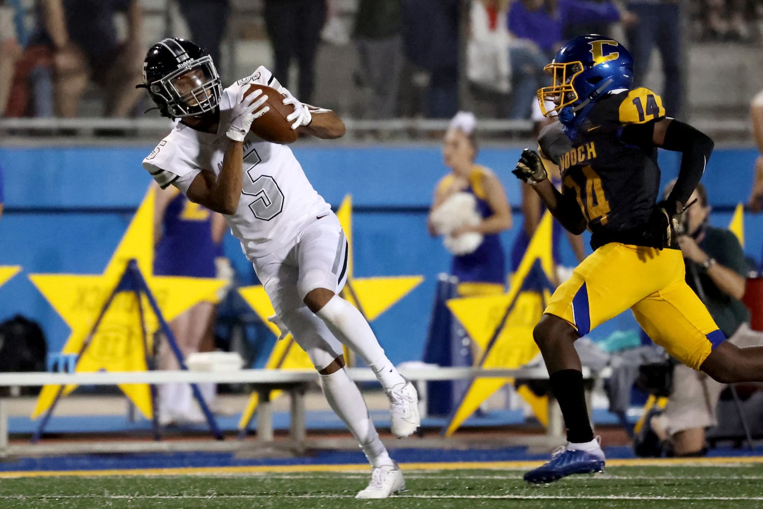 Alpharetta wide receiver Jaden Slocum (5) catches a long pass for a touchdown against Chattahoochee defensive back Tim Reed (14) in the second half at Chattahoochee high school Friday, September 25, 2020 in Johns Creek, Ga.. Alpharetta won 21-7. JASON GETZ FOR THE ATLANTA JOURNAL-CONSTITUTION