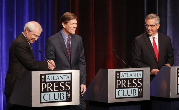 The candidates for Georgia secretary of state shake hands after they held a debate at GPB in Atlanta. The candidates are, from left, Democrat John Barrow, Libertarian Smythe DuVal and Republican Brad Raffensperger. BOB ANDRES / BANDRES@AJC.COM