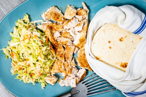 Fish Tacos with Shortcut Slaw. Henri Hollis/For The AJC