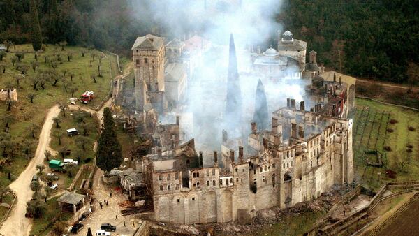 CHALKIDIKI, GREECE:  A file picture from 04 March 2004 shows the fire burning in the 12th century Serb orthodox Hilandari monastery in the northern Greek, all-male monk community of Mount Athos in Chalkidiki. Visiting Greece Serbian Prime Minister Voijslav  Kostunica will travel to the monastic community of Mount Athos on Tuesday, where he is scheduled to visit the Serbian monastery of Hilandari.The 12th-century monastery was seriously damaged by fire last year, but is currently undergoing repairs which Greece is helping fund, Kostunica said. AFP PHOTO /FILES/Fotis Filargyropoulos  (Photo credit should read FOTIS FILARGYROPOULOS/AFP/Getty Images)