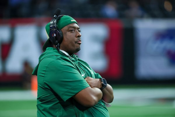 Langston Hughes head coach Daniel Williams is shown on the sideline during the first half against Milton in the GHSA Class 5A State Championship game at Mercedes-Benz Stadium, Tuesday, December 17, 2024, in Atlanta. Milton won 56-35. (Jason Getz / AJC)
