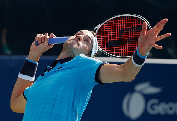 John Isner serves to Ryan Harrison during the BB&T Atlanta Open at Atlantic Station on July 30, 2017 in Atlanta, Georgia.